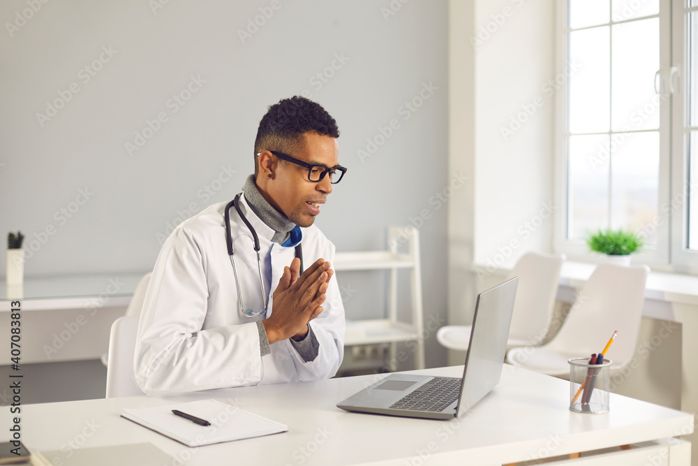 Polite greeting, respect, good service, virtual collaboration: Happy online doctor thanks client for trust with Namaste palms pressed together gesture or says hello or sorry in live video call meeting Polite greeting, respect, good service, virtual collaboration: Happy online doctor thanks client for trust with Namaste palms pressed together gesture or says hello or sorry in live video call meeting
