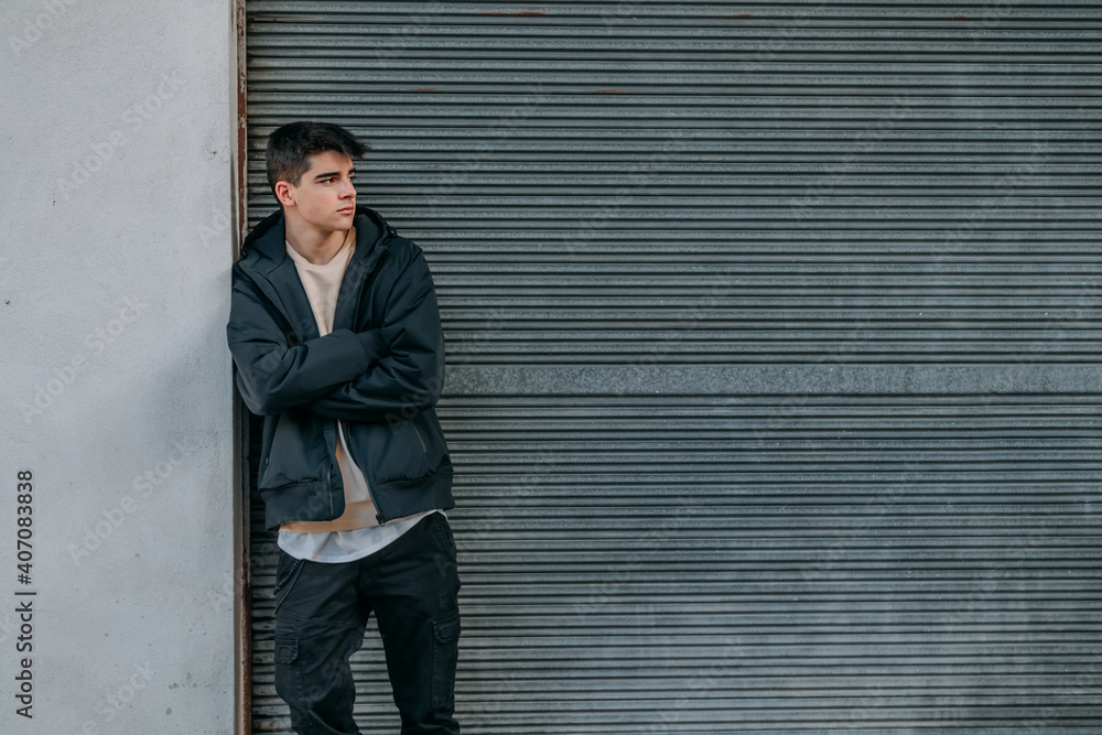 young urban teenager in casual style on the street outdoors young urban teenager in casual style on the street outdoors