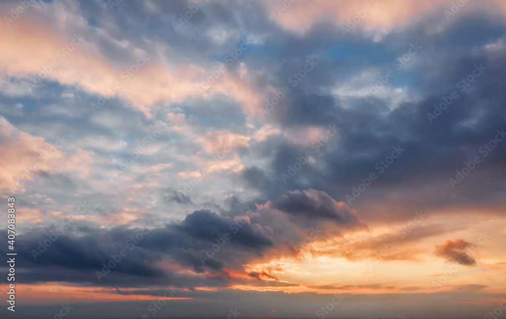 Beautiful sunset sky background with clouds.