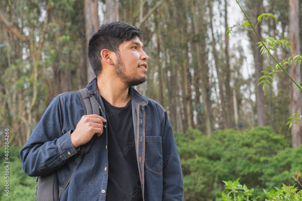 Young man walking in the woods. Young man walking in the woods.