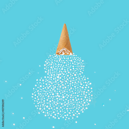 Snowflakes fall out of the cone and form a snow white on a blue background. Abtract concept of winter. photo