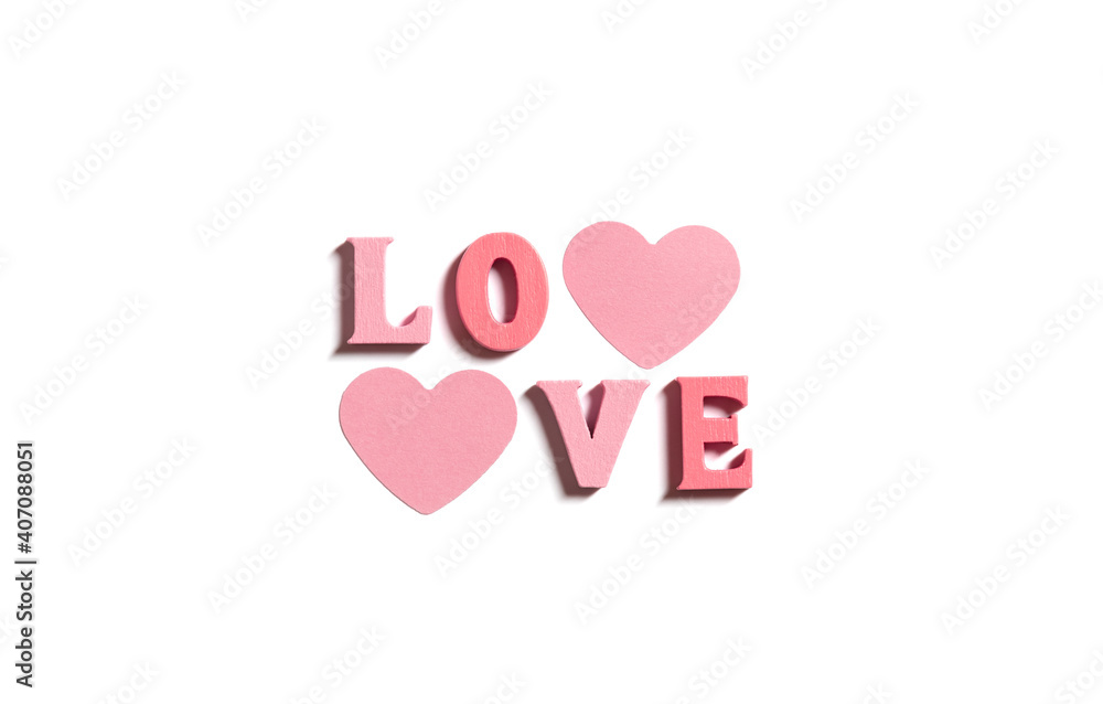 Love text with wooden letters on white background. Valentine's day or wedding greeting card. The concept of love. Top view, flat lay. Love text with wooden letters on white background. Valentine's day or wedding greeting card. The concept of love. Top view, flat lay.