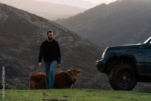 Guy exploring with their off road cars in the mountains © Dario