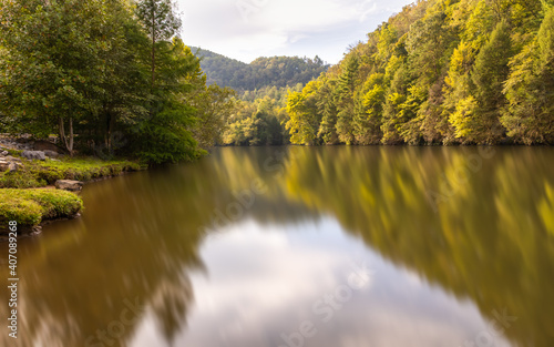 A calm reflective river in the Appalachian Mountains.
