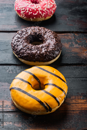 Donuts Set, on old dark  wooden table background