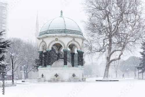 Photography The beautiful landscape with German Fountain in old Hippodrome, Istanbul, Turkey one winter day with many snow