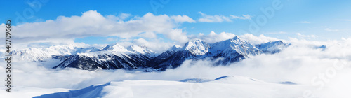 Panoramic view of mountains near Brianson, Serre Chevalier resort, France. Ski resort landscape on clear sunny day. Mountain ski resort. Snow slope. Snowy mountains. Winter vacation. Panorama