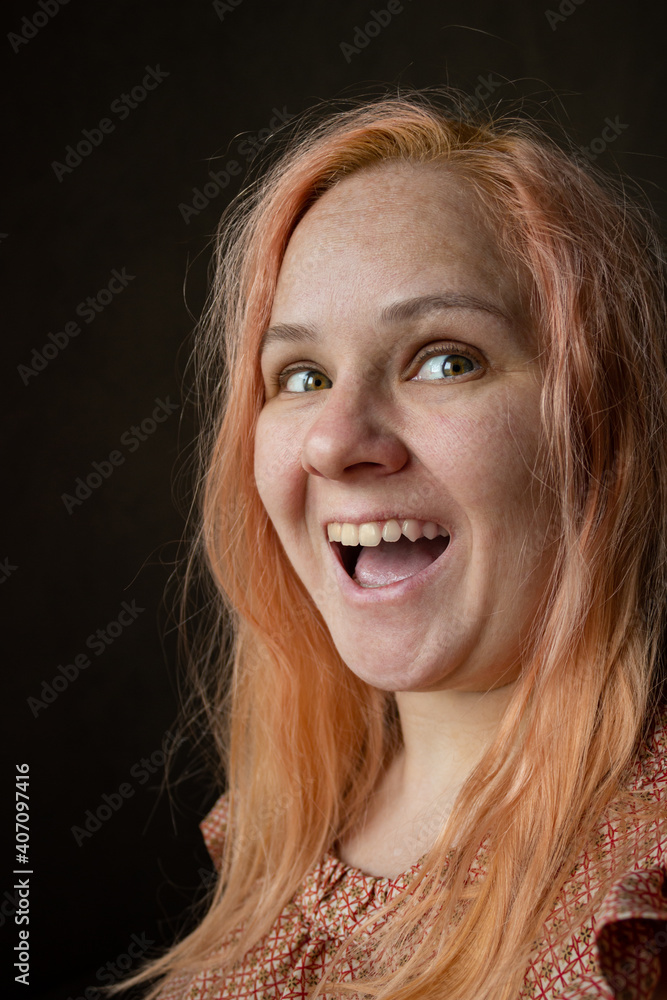 Close-up portrait of a girl with orange hair without makeup and skin retouching. Close-up portrait of a girl with orange hair without makeup and skin retouching.