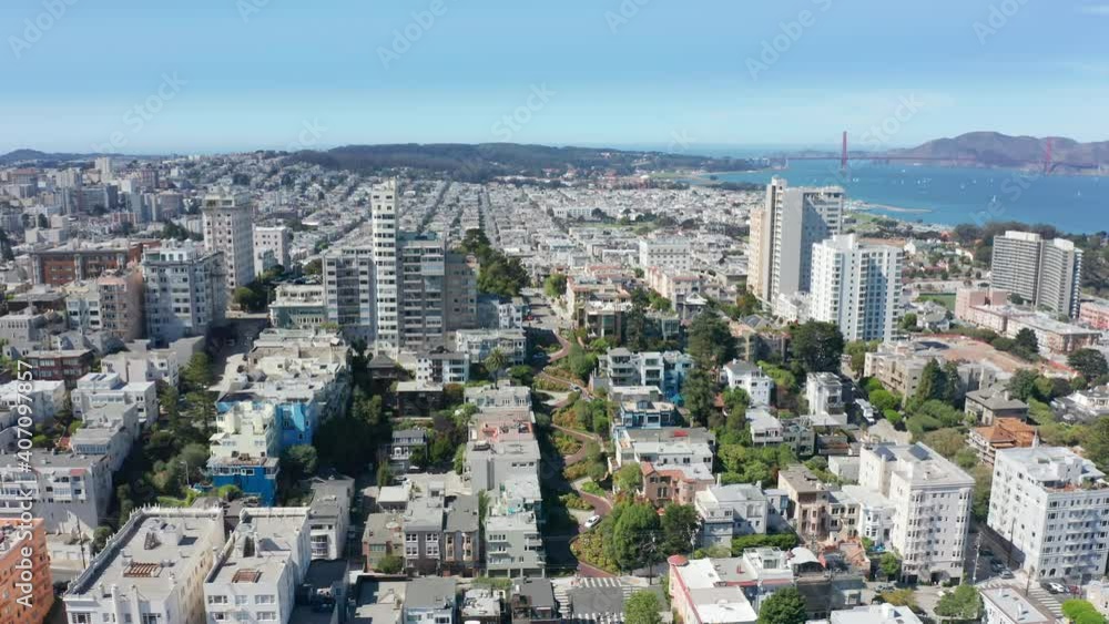 Scenic San Francisco bay and historic pat of city aerial view. World famous colorful victorian architecture buildings and red Golden Gate bridge landmark on moving background. Summer vacation 4K USA Scenic San Francisco bay and historic pat of city aerial view. World famous colorful victorian architecture buildings and red Golden Gate bridge landmark on moving background. Summer vacation 4K USA