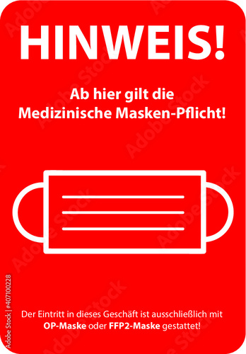 Rotes Hinweis Schild für die medizinische Masken-Pflicht in Geschäften