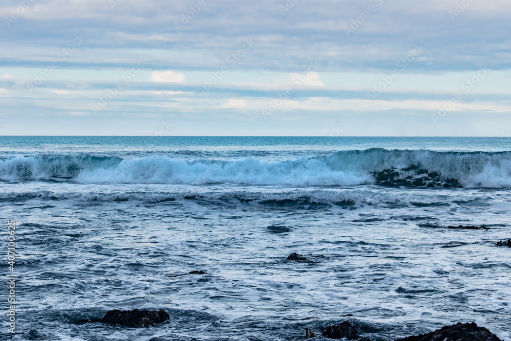 Lowlight panorama of powerful wave breaking  in landscape scenery of Atlantic Ocean