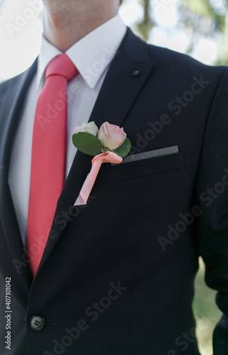 Groom's necktie and boutonier photo