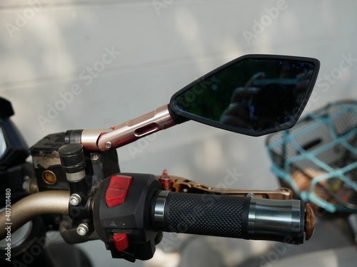 closeup of motorcycle rear view mirror.