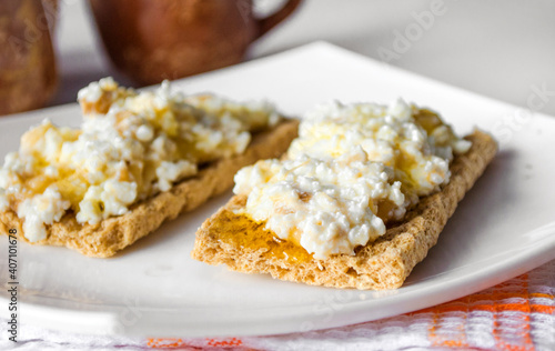 breakfast of bread with cottage cheese and honey