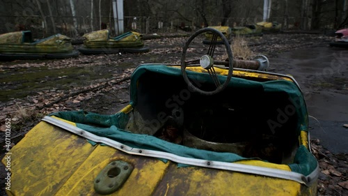 Decayed Autodrome with bumper cars in ghost town Pripyat in radioactive chernobyl exclusion zone photo