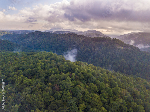 Aerial view of clouds rising from the forest in the Blue Ridge Mountains of North Carolina.