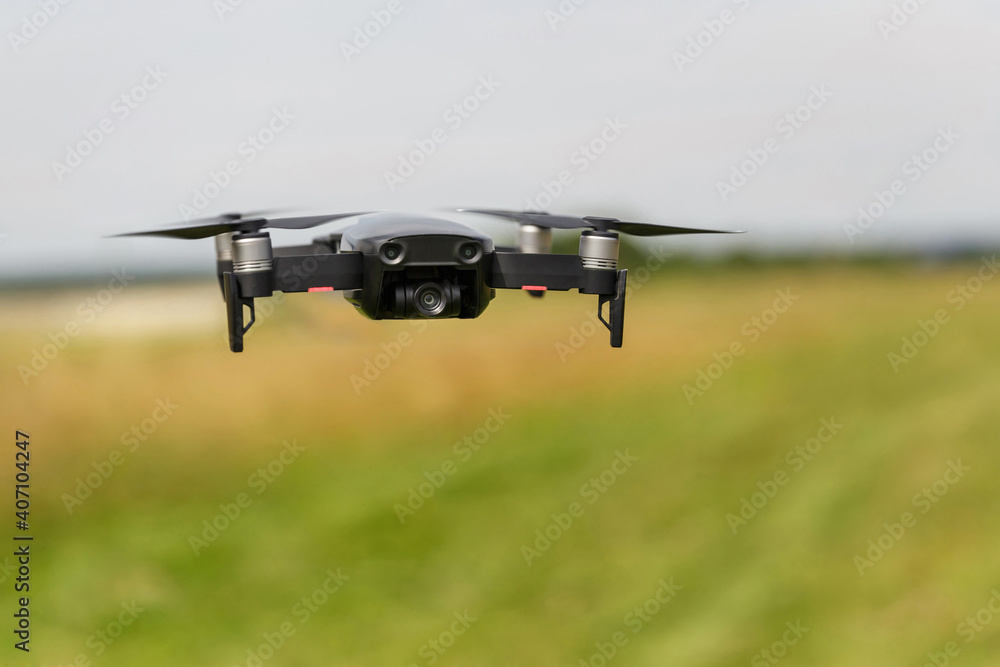 Quadcopter with digital camera in flight. Drone in the film industry. Broadcast and record with a digital quadcopter camera. Quadcopter with digital camera in flight. Drone in the film industry. Broadcast and record with a digital quadcopter camera.