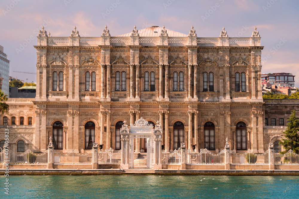 Summer view on the bank of Bosporus Strait with central building of the Dolmabahce Palace, a museum in ornate Ottoman sultan palace in Besiktas district of Istanbul
