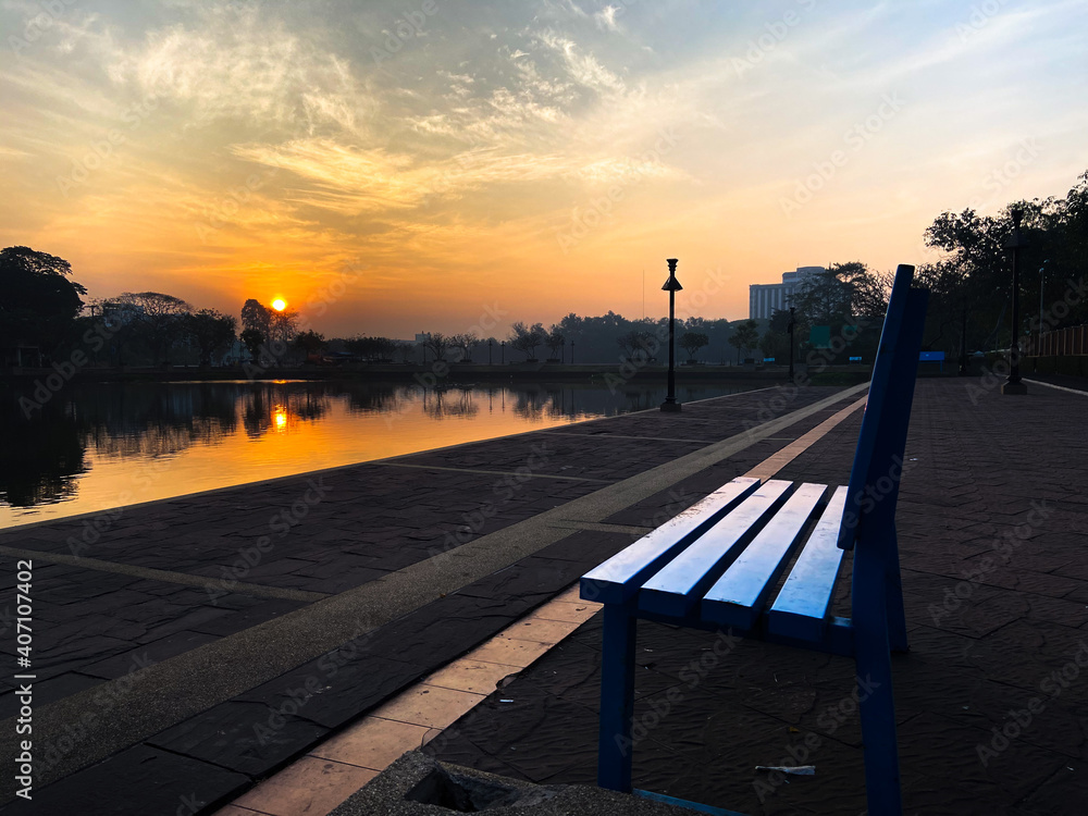 Pool benches in the park with the morning sunrise.