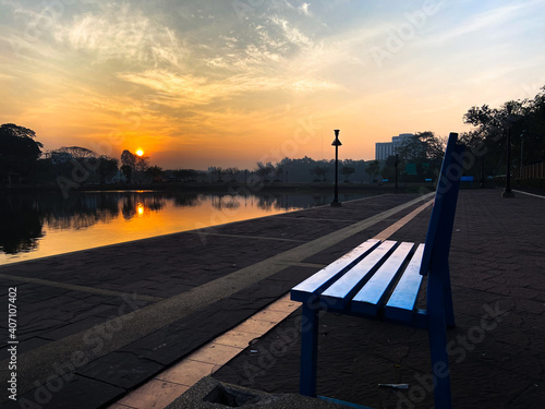 Pool benches in the park with the morning sunrise. © 1307K&O