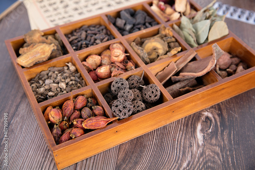 There are all kinds of traditional Chinese medicine in the wooden box photo