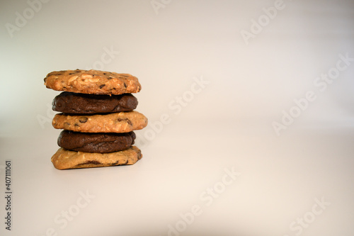  a pile of alomod chocolate cookie on white background
