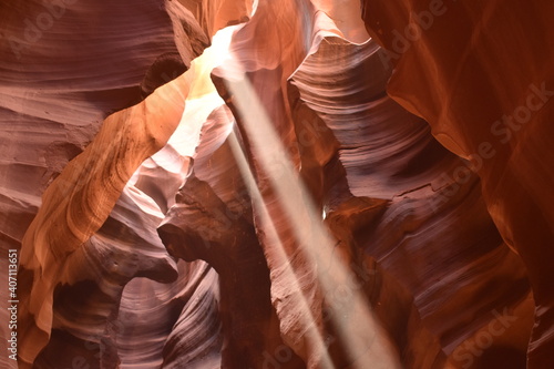 Rays of light shine through crevices within Antelope Canyon, Arizona