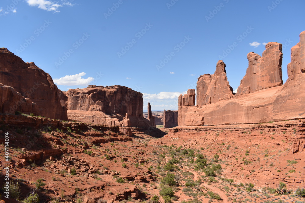 A scenic view of rock formations along the highway through Arches National Park, Utah.