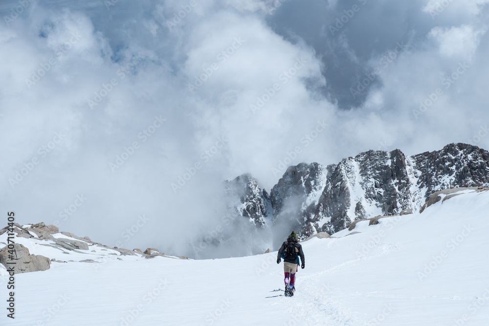 Trail Running on Sierra Nevada Mountain Range, mountaineering, mountains with snow and cloud cover