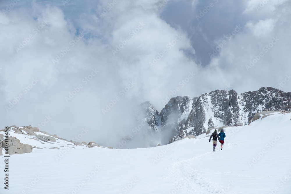 Trail Running in the snow, Sierra Nevada Mountain Range, Snow and cloud cover, Mt Whitney Approach Route, Lone Pine, CA, US, May 25, 2019 Trail Running in the snow, Sierra Nevada Mountain Range, Snow and cloud cover, Mt Whitney Approach Route, Lone Pine, CA, US, May 25, 2019
