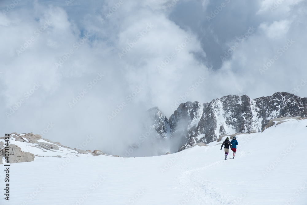 Trail Running in the snow, Sierra Nevada Mountain Range, Snow and cloud cover, Mt Whitney Approach Route, Lone Pine, CA, US, May 25, 2019