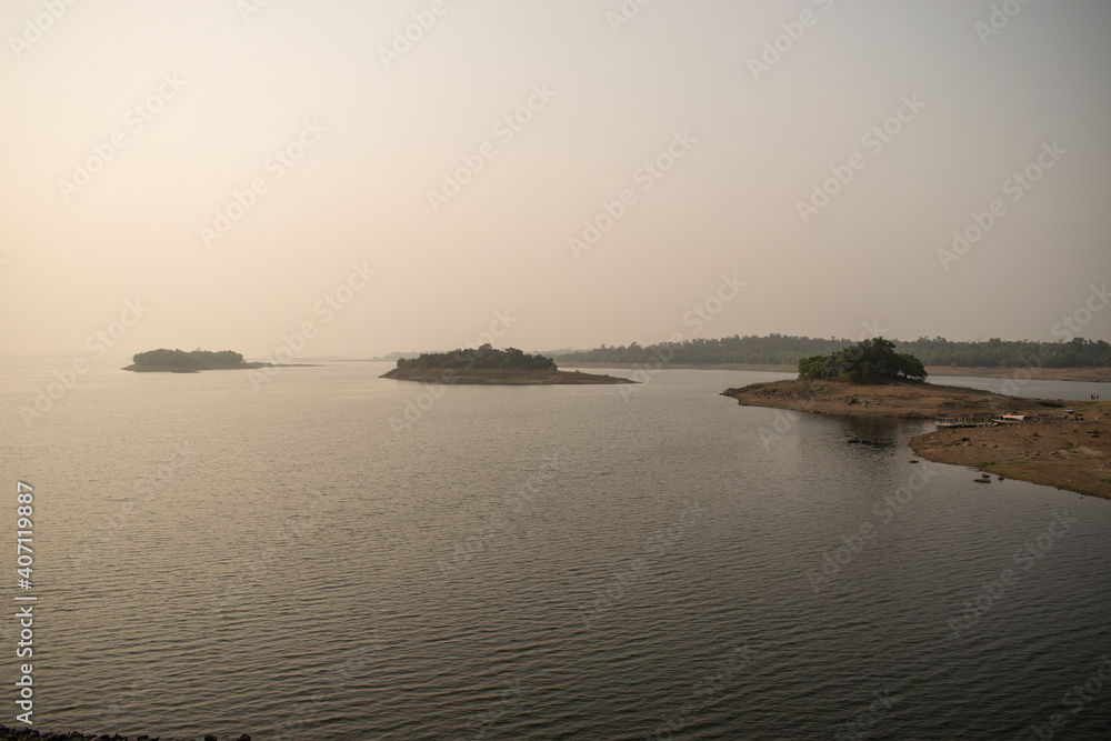 distant view of kumari river in a hazy afternoon at mukutmanipur, a weekend destination at bankura district of west bengal, india
