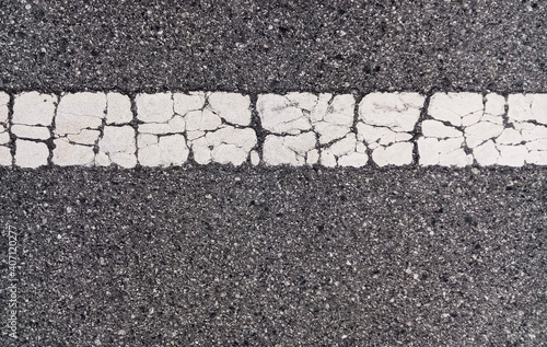 Cracked white line on pavement