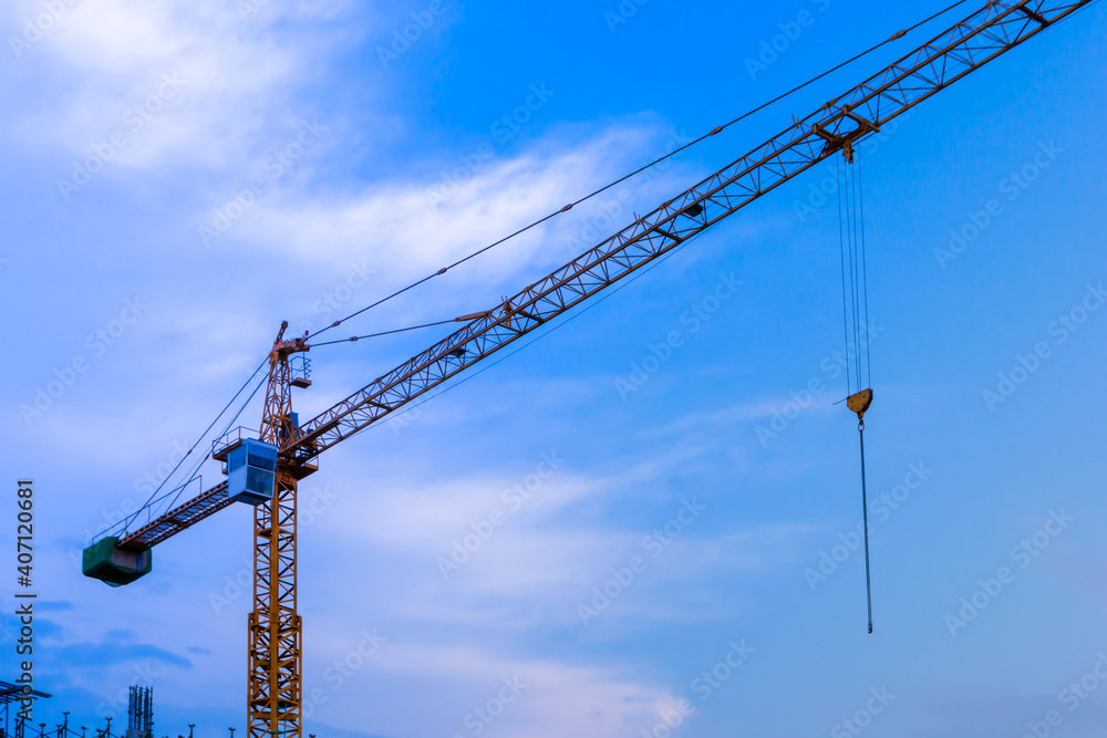 Constuction site building a tower working by crane see sky background