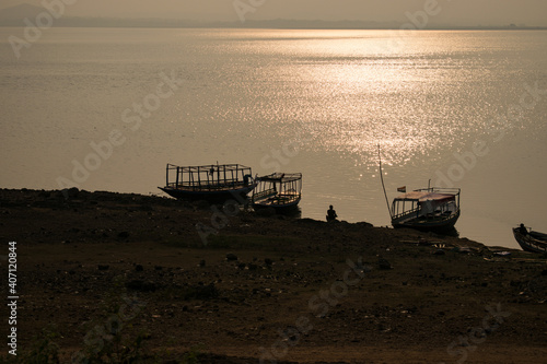 fishing boat at sunset photo