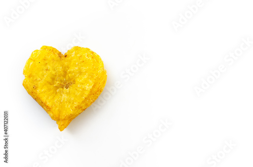 Heart shaped fried plantain isolated on white background photo