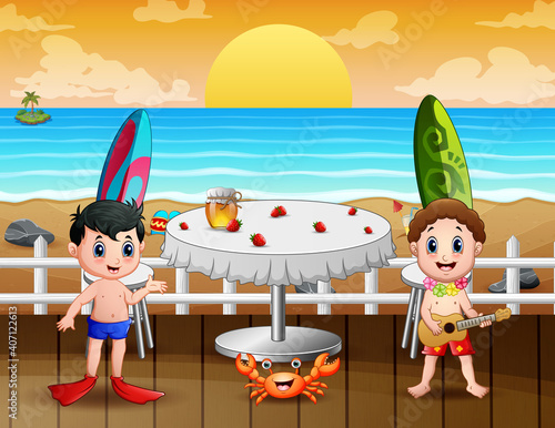 Happy vacation kids in the restaurant near the beach