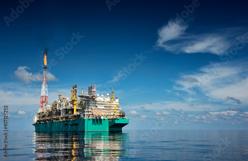 FLNG or floating  liquefied natural gas at sea with beautiful cloudy sky
