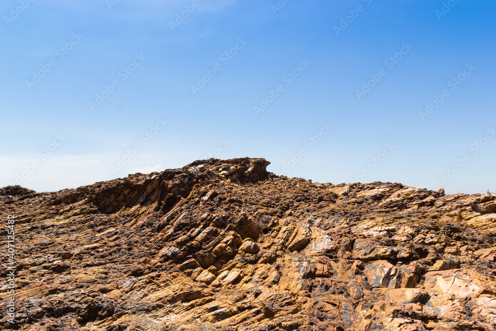 Brow mountain rock blue sky background