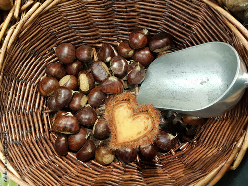 chestnuts love heart  in the basket bailer in market place food background colors