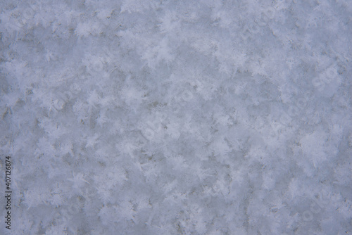 Background, texture of fresh fallen snow. Snowflakes close-up. The winter time of year