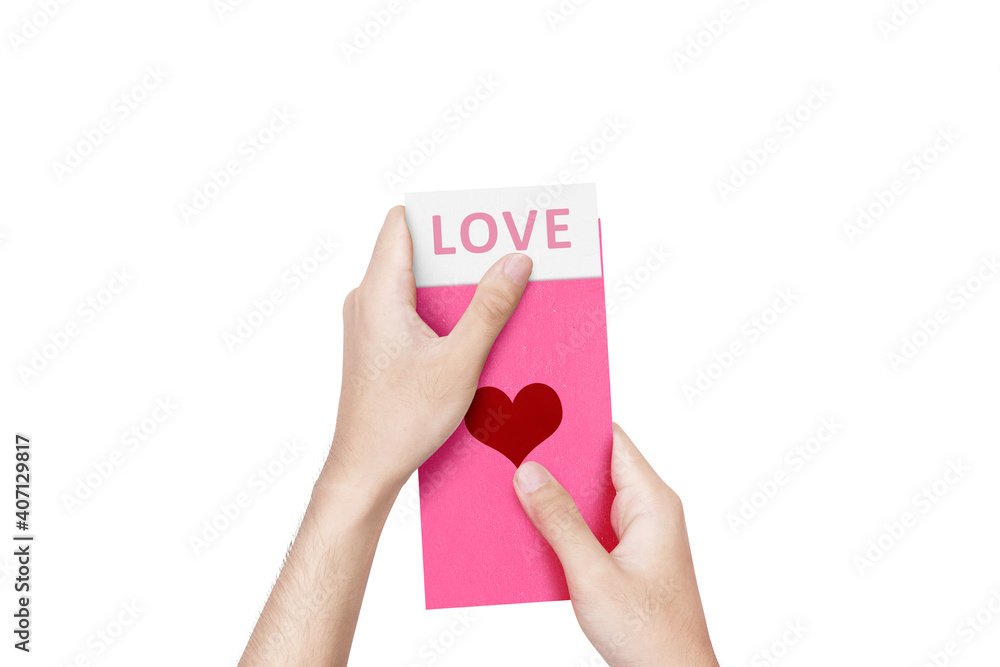 Human hand opening a pink envelope with heart shape with love text on the paper Human hand opening a pink envelope with heart shape with love text on the paper