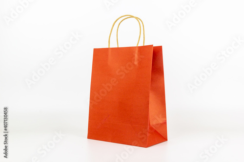 red paper bag made from nature help preserve the environment, isolated