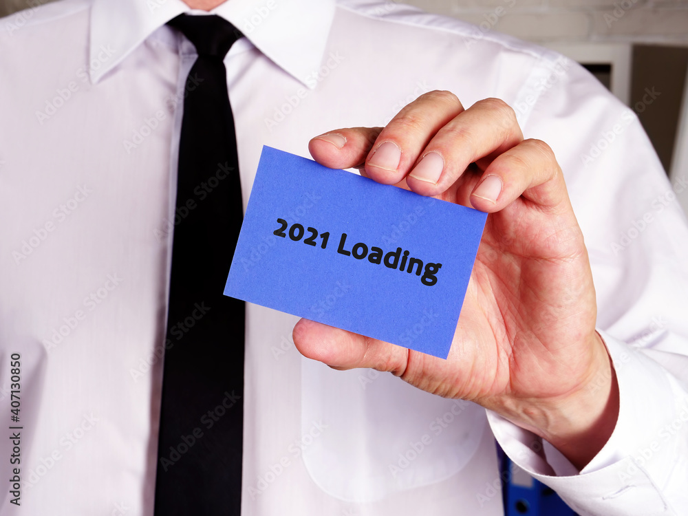 Business concept meaning 2021 Loading with phrase on the piece of paper. Business concept meaning 2021 Loading with phrase on the piece of paper.
