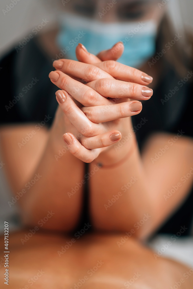 custom made wallpaper toronto digitalLomilomi Practitioner wearing a Protective Mask, Giving Back Massage at a Wellness Center