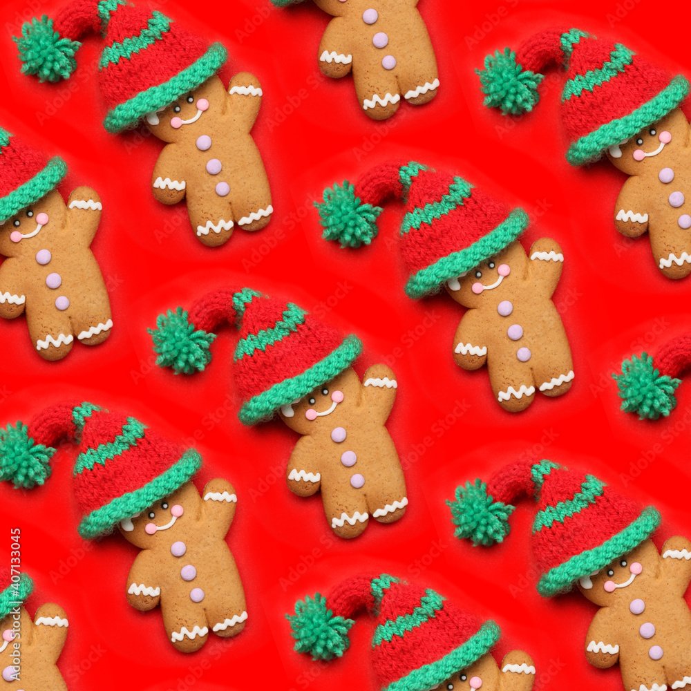 Tasty gingerbread cookies with knitted hats on color background