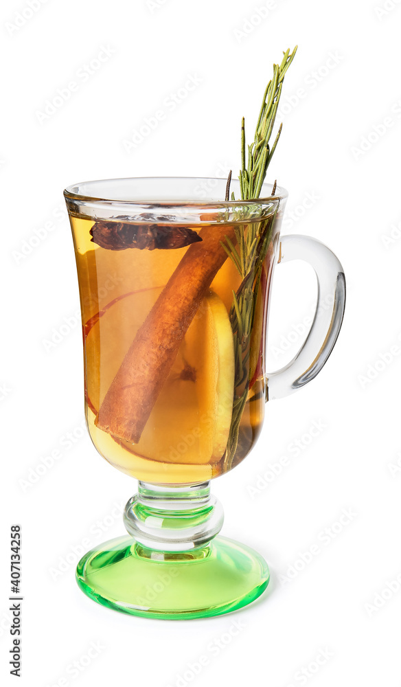 Tasty drink with spices and apple slices in cup on white background Tasty drink with spices and apple slices in cup on white background