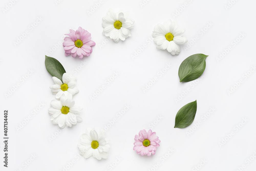 Obraz premium Frame made of beautiful flowers on white background