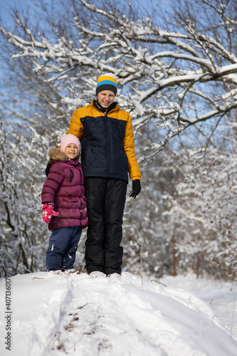 Two children on a walk in winter