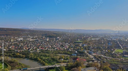 Panoramic view on a small city at above in the autumn over the Uzh River Uzhhorod Ukraine Europe photo